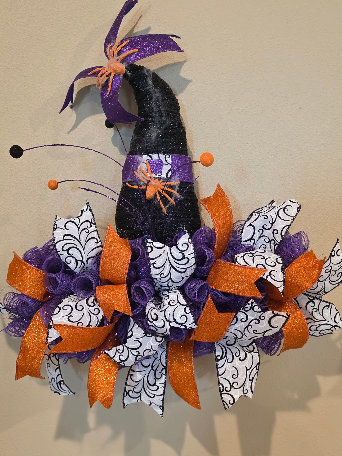 Witch hat wreath with orange spiders