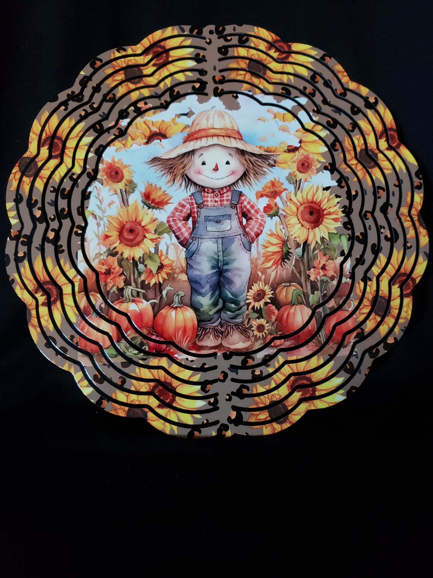 Wind spinner scarecrow