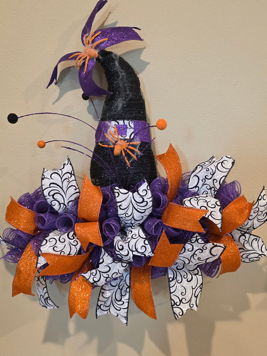 Witch hat wreath with orange spiders